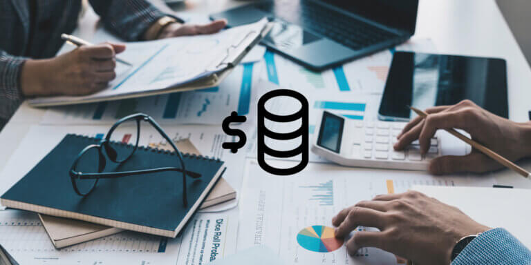 An image showing the hands of workers on an office desk and a coins icon in the middle.
